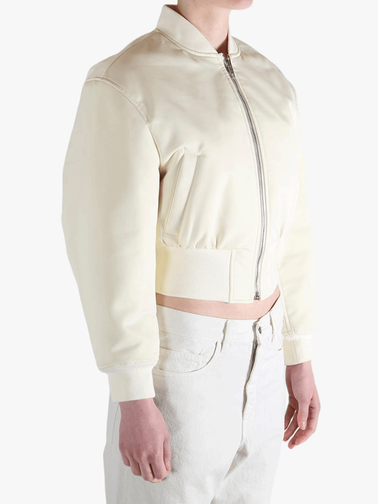 White jackets worn by a person, showing the jackets fit