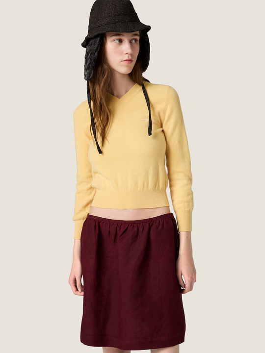 Yellow knitwear, full body view