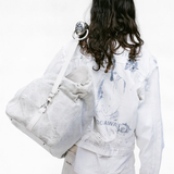 White jacket worn by a person, showing the jacket's fit