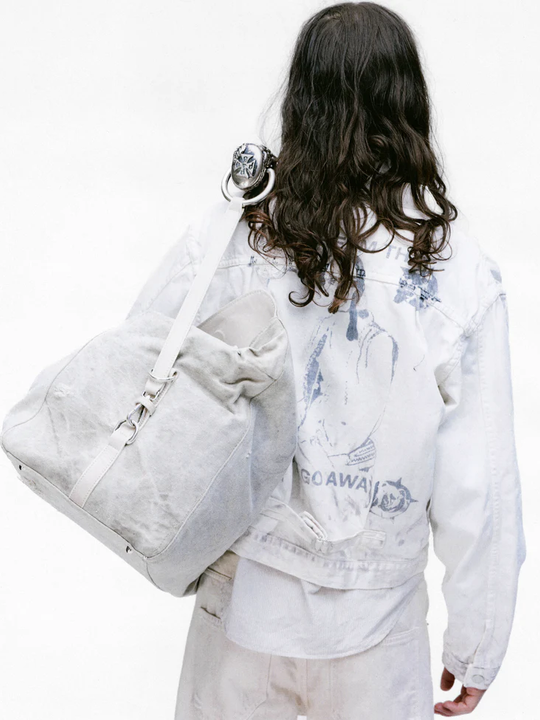 White jacket worn by a person, showing the jacket's fit