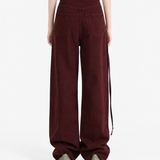 Burgundy pants, full body view