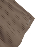 Close up of Brown shorts, showing texture of the 73% polyamide/ 27% elastane fabric