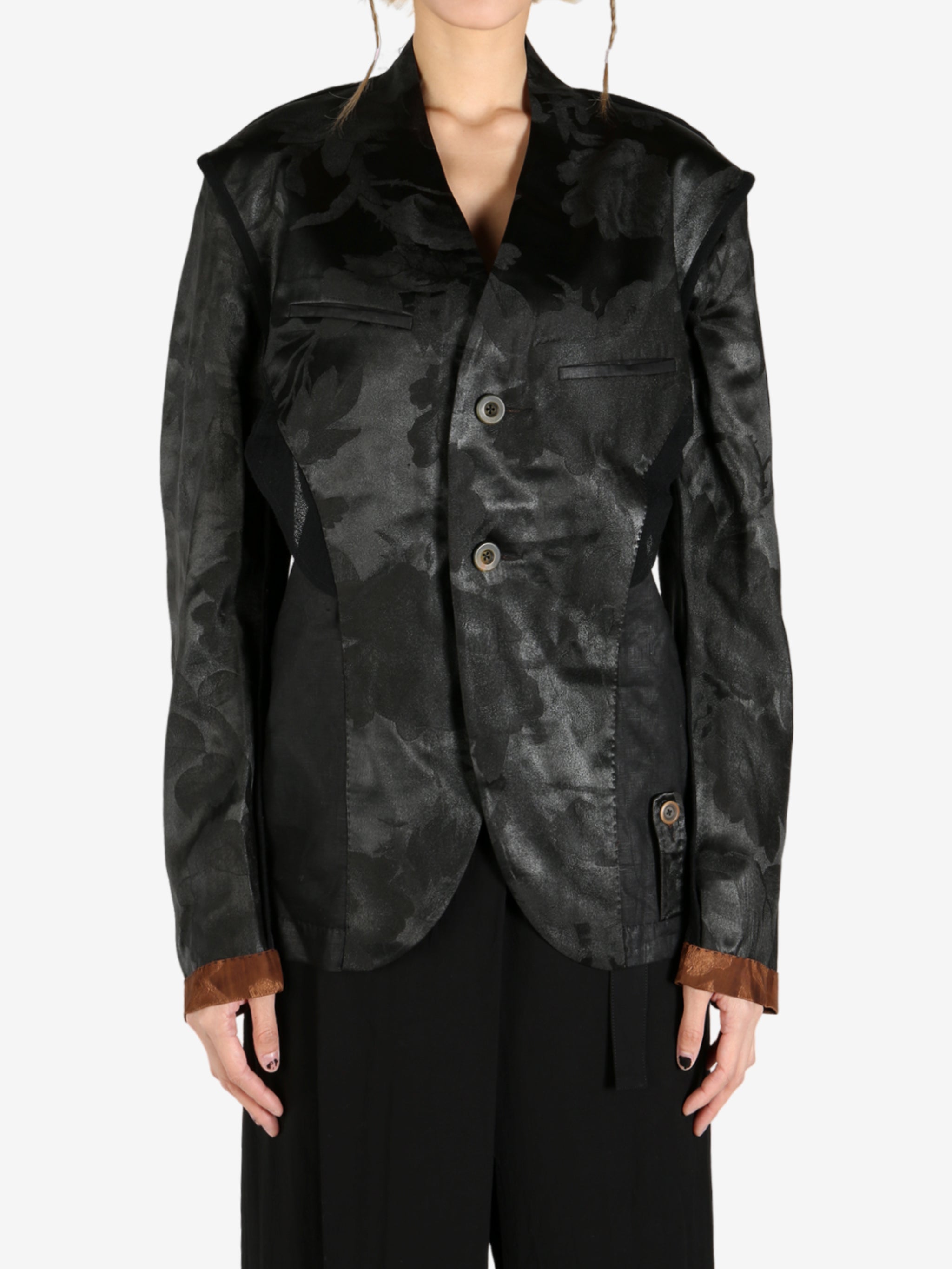 Black jacket worn by a person, showing the jacket's fit