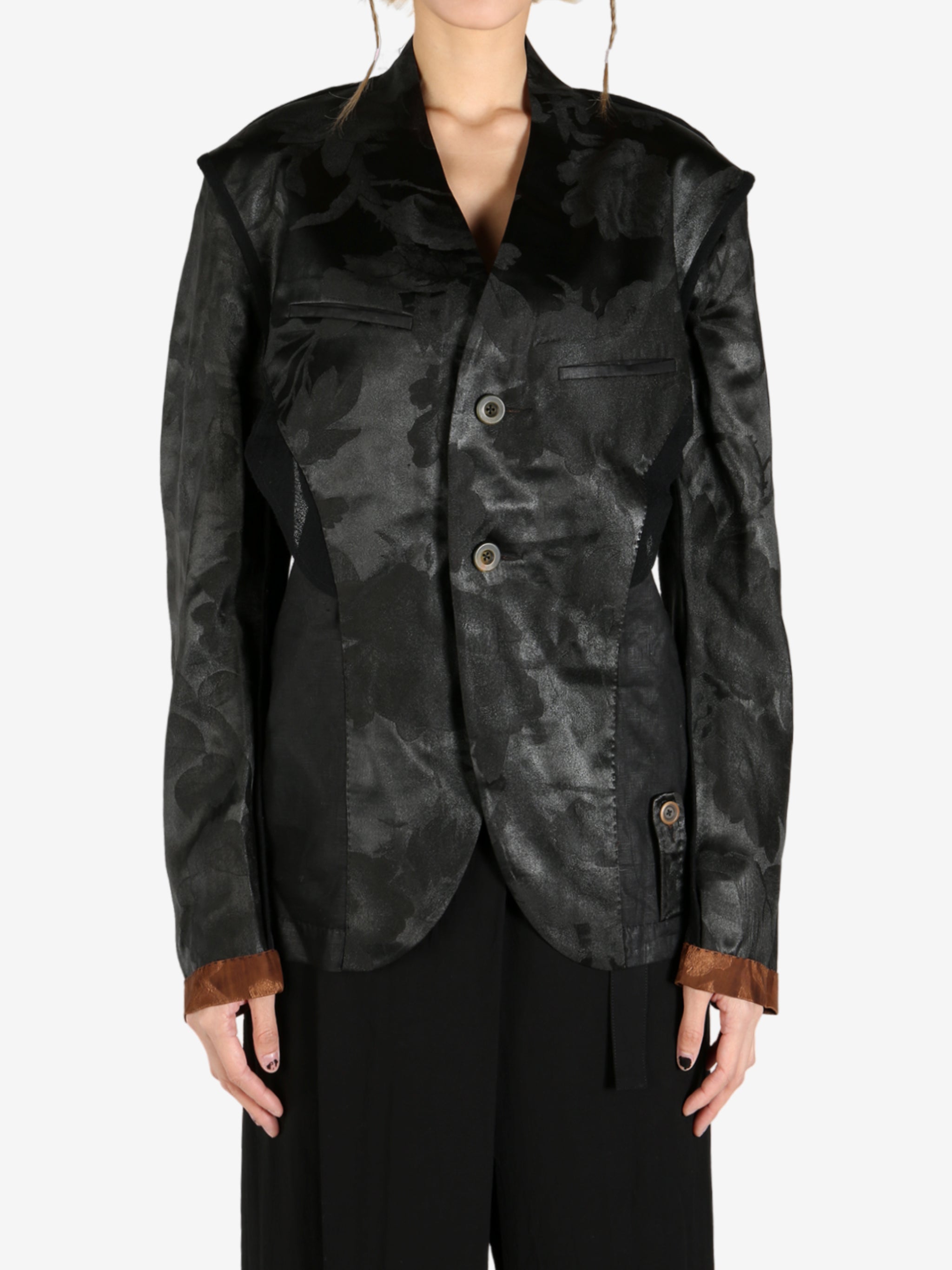 Black jacket worn by a person, showing the jacket's fit