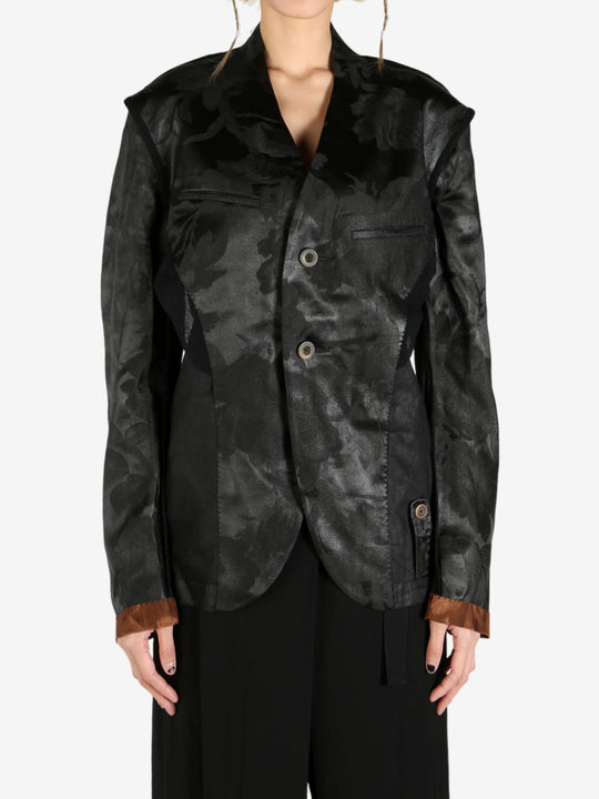 Black jacket worn by a person, showing the jacket's fit