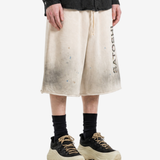 Tan shorts worn by a person, showing the shorts fit