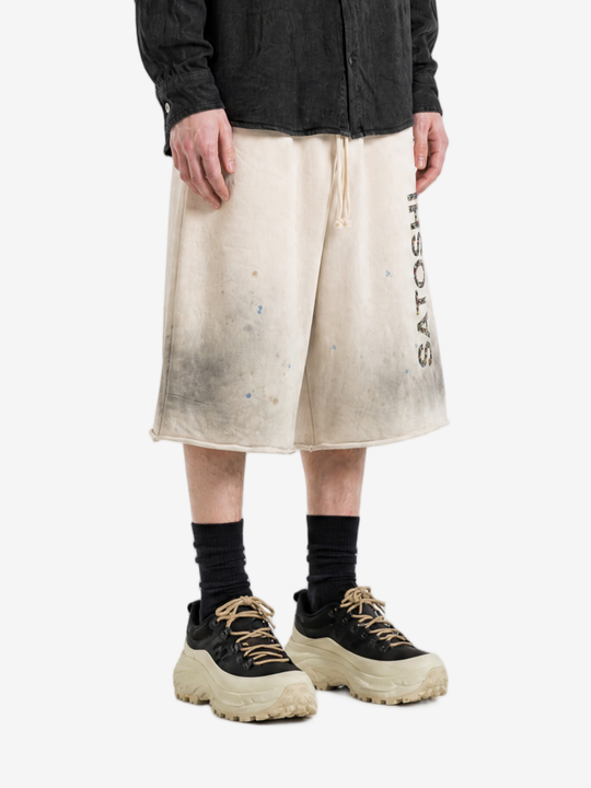 Tan shorts worn by a person, showing the shorts fit