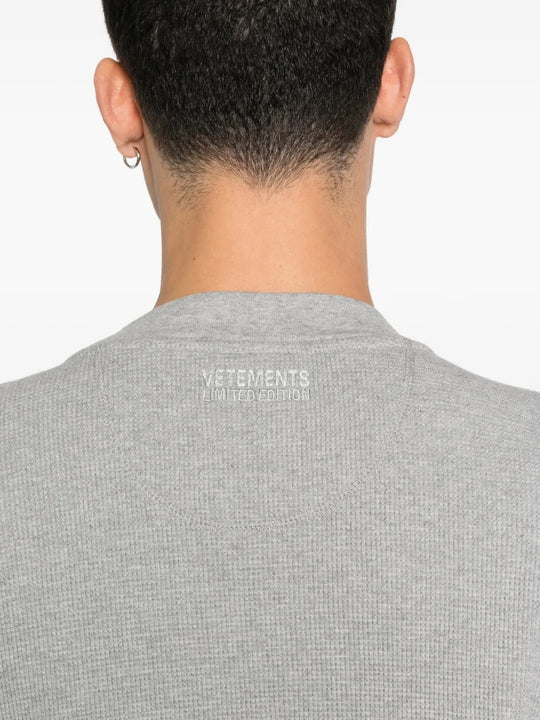 Close up of the grey sweats, showing texture of the cotton fabric