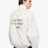Tan jacket worn by a person, showing the jacket fit