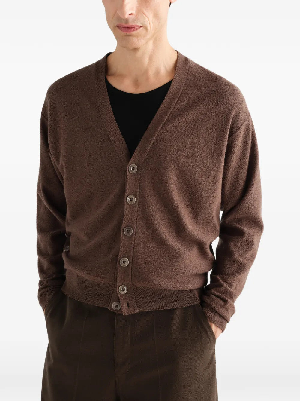 Brown knitwear worn by a person, showing the knitwear fit