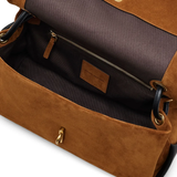 Close up of brown bags, showing texture of the suede cow leather fabric