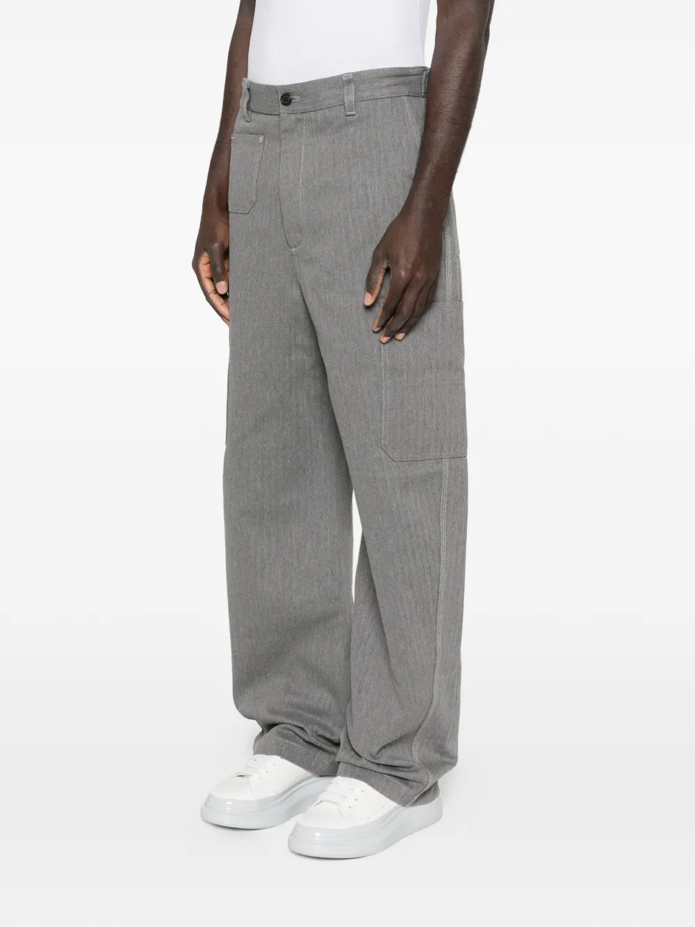 Grey pants worn by a person, showing the pants fit