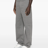 Grey pants worn by a person, showing the pants fit