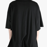 Black t-shirts worn by a person, showing the t-shirts fit