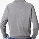 Grey knitwear  worn by a person, showing the knitwear's fit