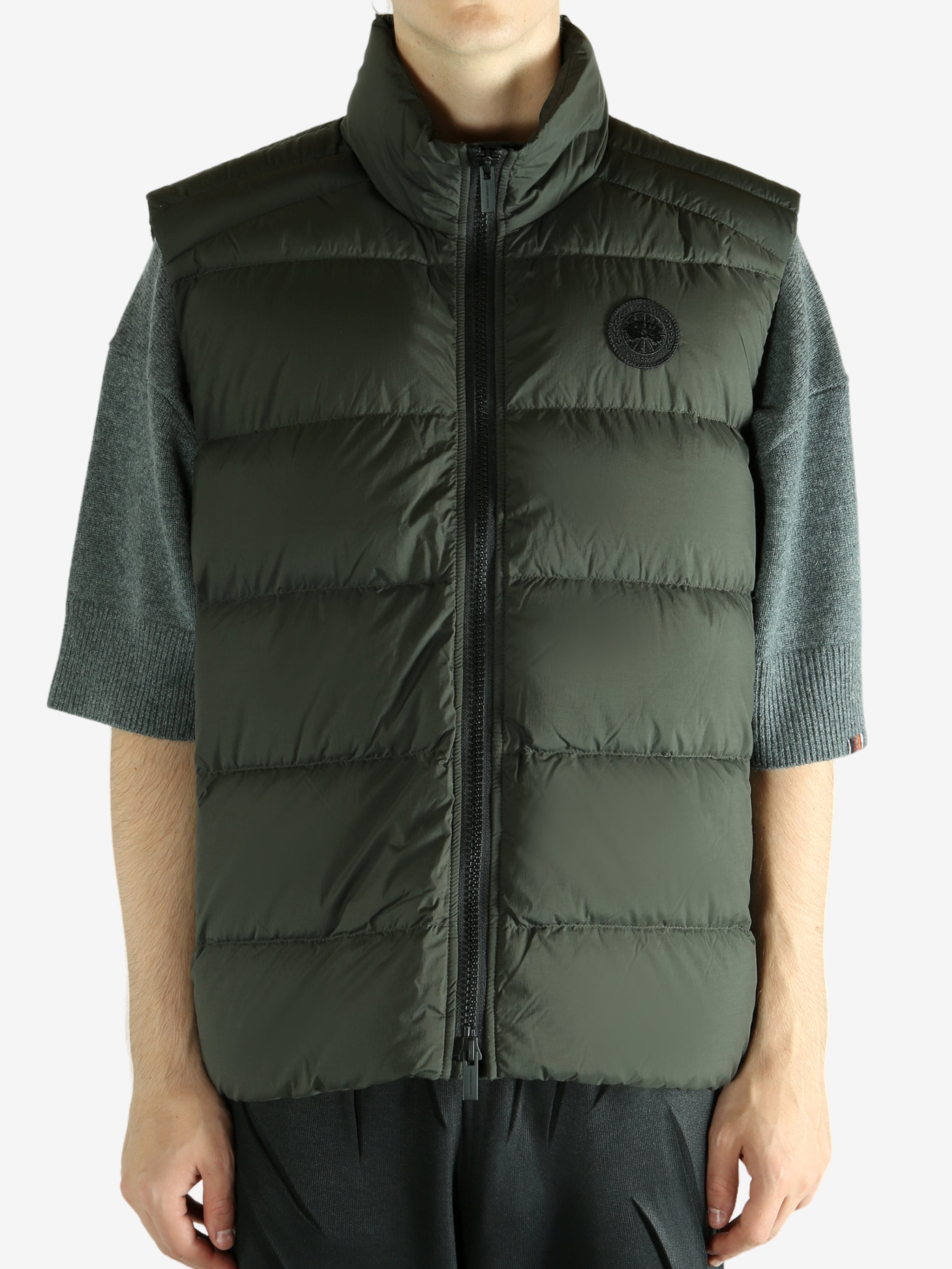 Green vest worn by a person, showing the vest's fit