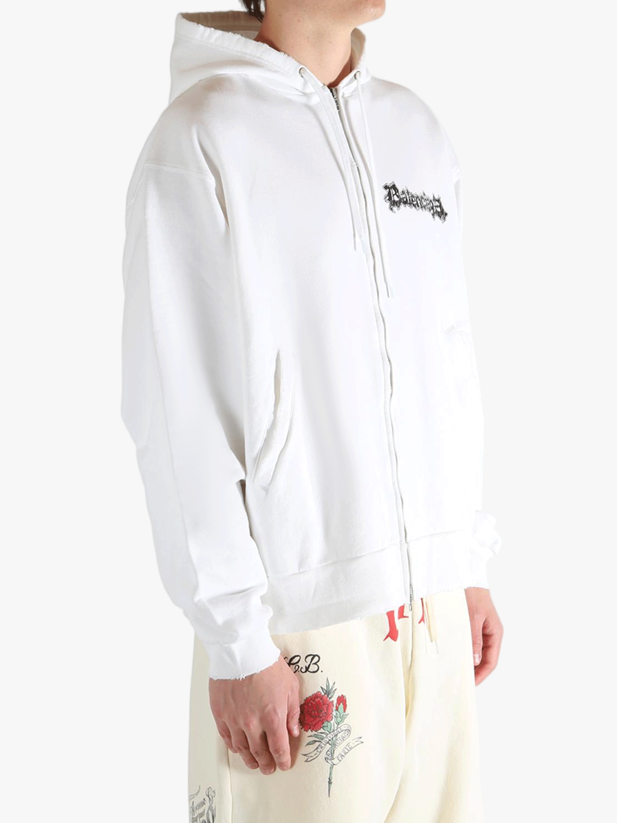 White hoodies worn by a person, showing the hoodies fit