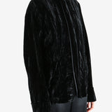 Black jacket worn by a person, showing the jacket's fit