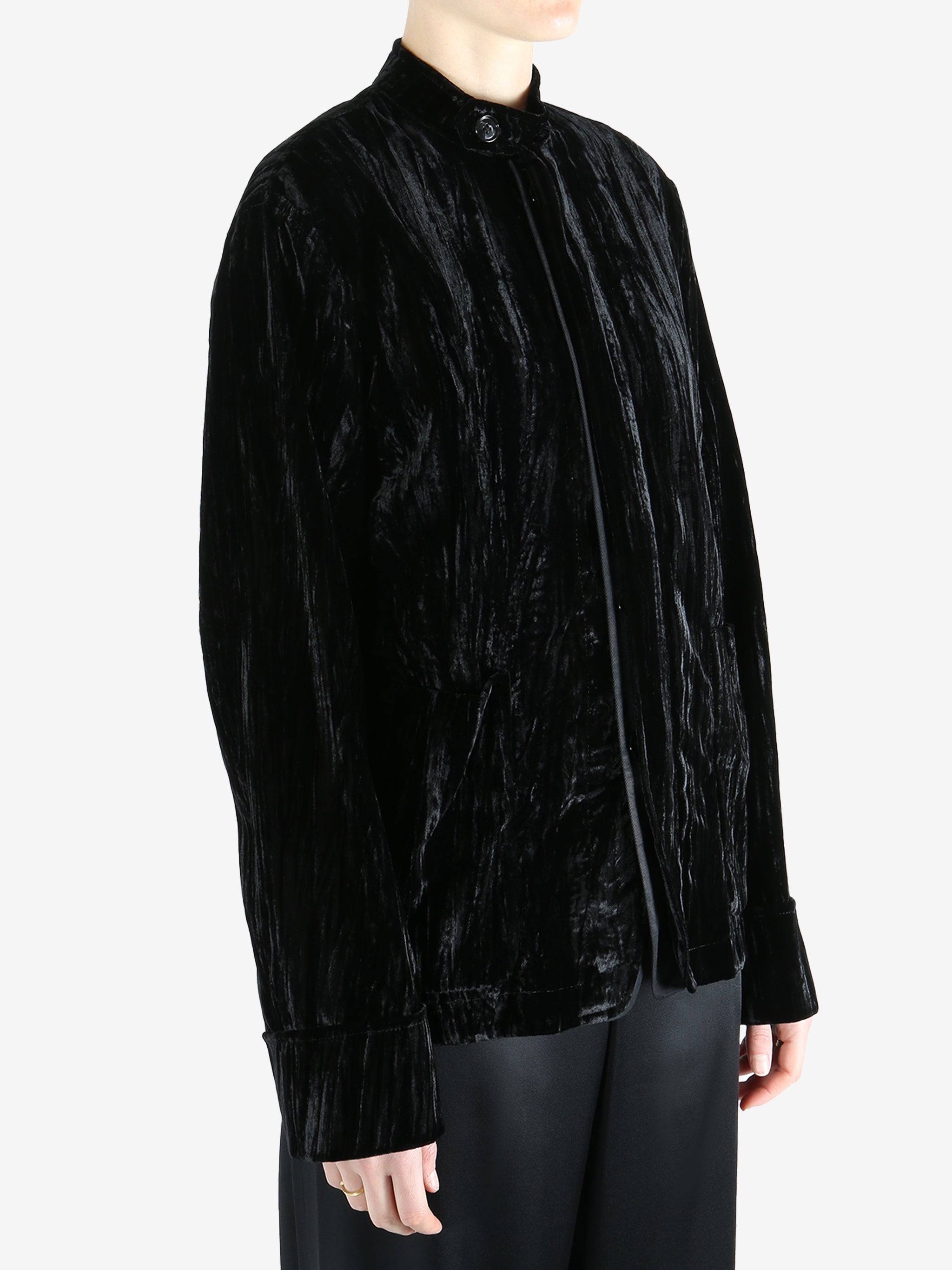 Black jacket worn by a person, showing the jacket's fit