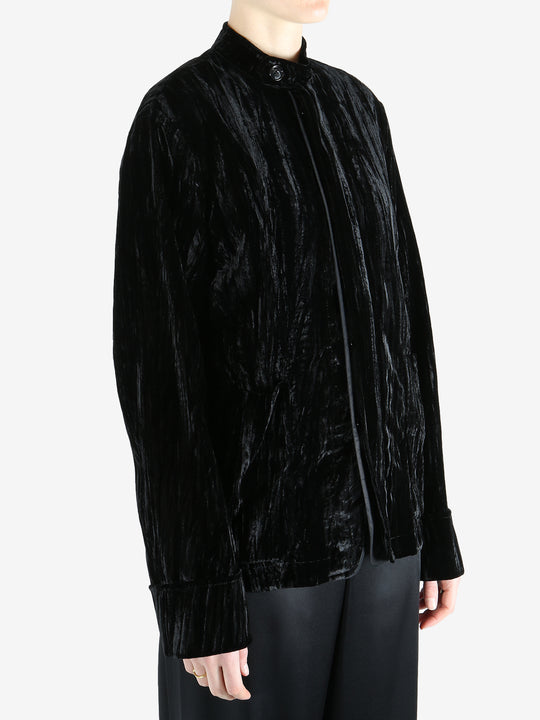 Black jacket worn by a person, showing the jacket's fit