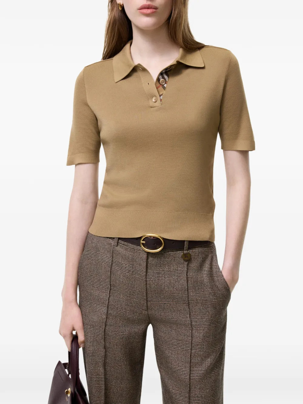 Tan shirt worn by a person, showing the shirt fit