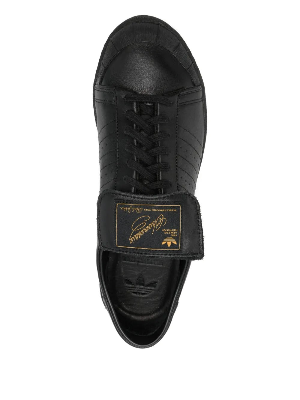 Close up of black shoes, showing texture of the rubber and calf leather fabric