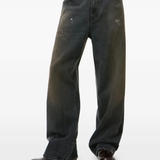 Grey pants, worn by a person, showing the t-shirt fit