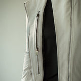 Close up of grey jacket, showing texture of the fabric