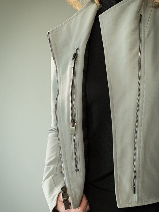 Close up of grey jacket, showing texture of the fabric