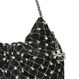 Close up of black bag, showing texture of the suede fabric