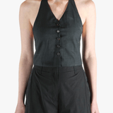 Black top worn by a person, showing the top's fit