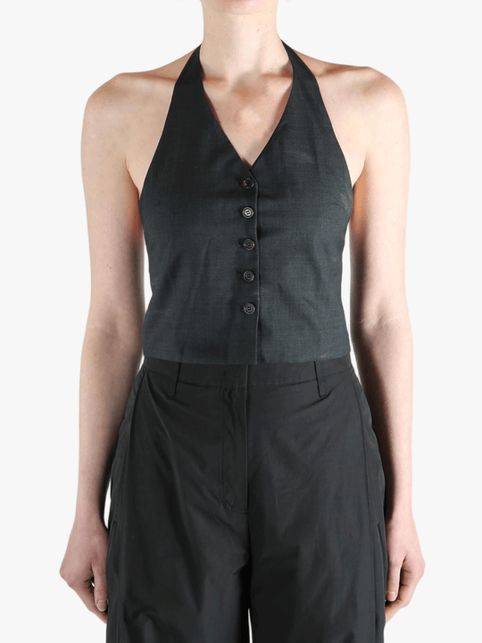 Black top worn by a person, showing the top's fit
