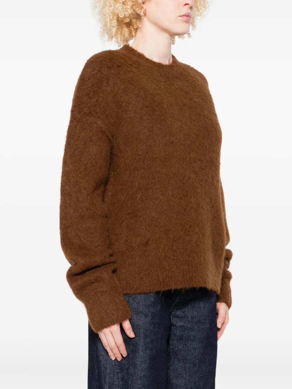 Brown sweater worn by a person, showing the sweater fit