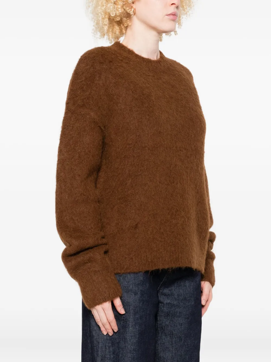 Brown sweater worn by a person, showing the sweater fit