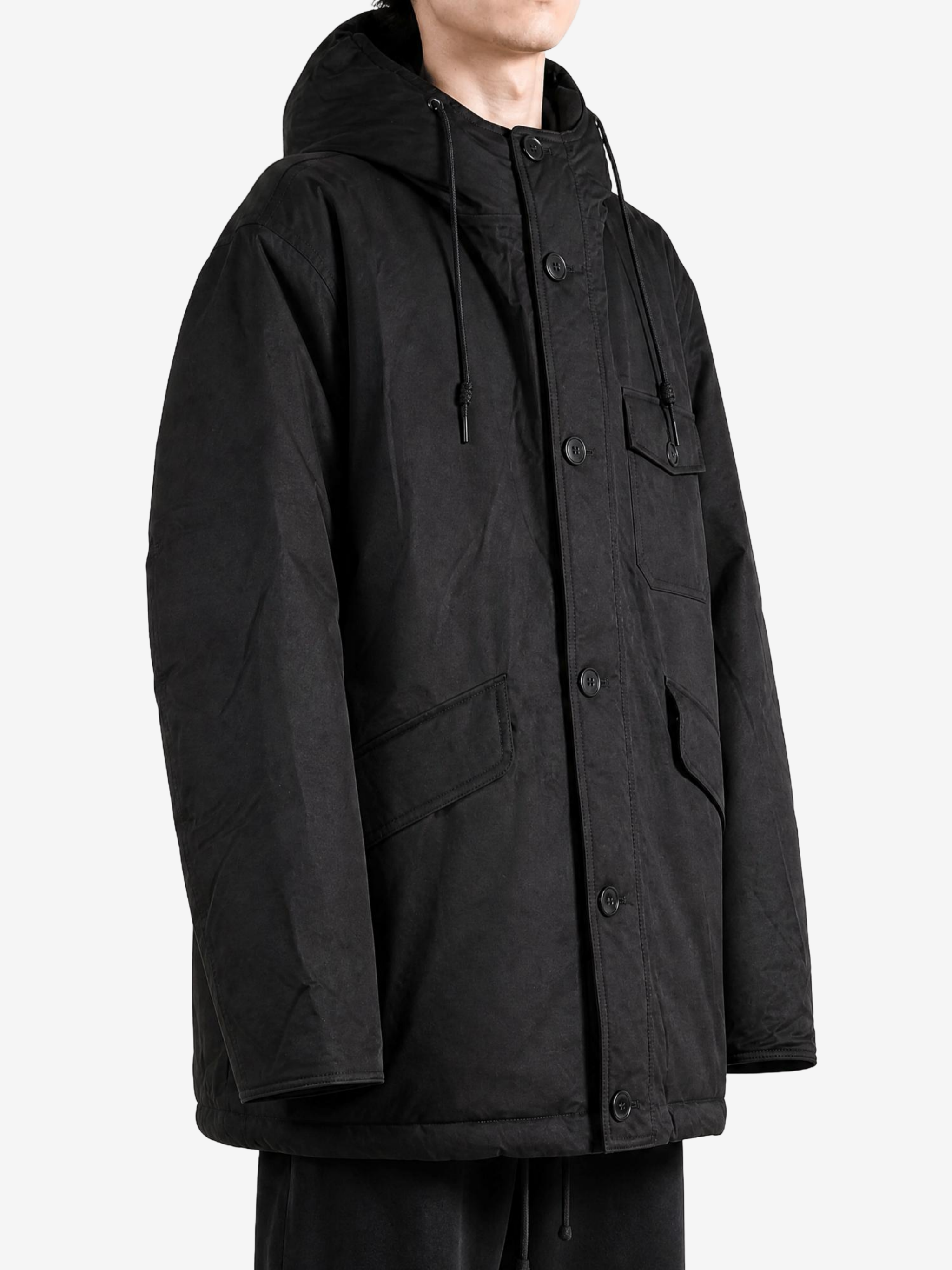 Black jacket worn by a person, showing the jacket fit