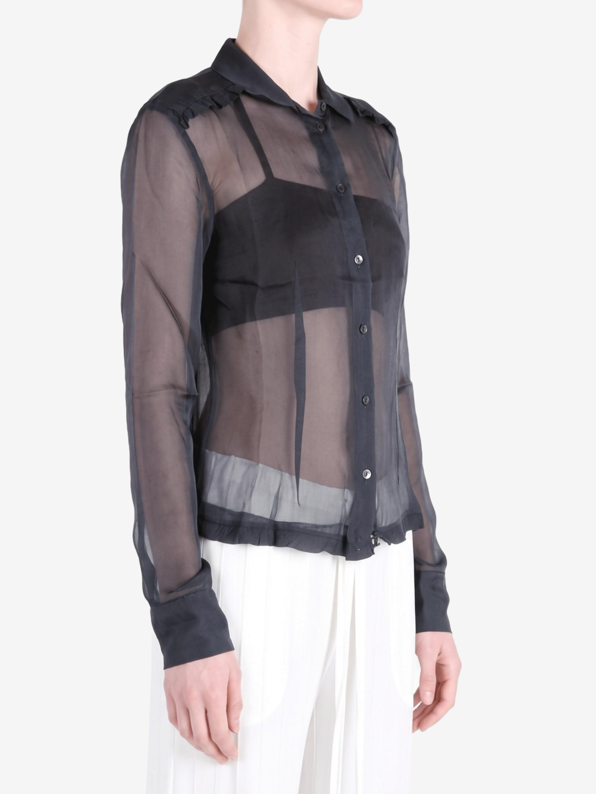 Black shirt worn by a person, showing the shirt fit