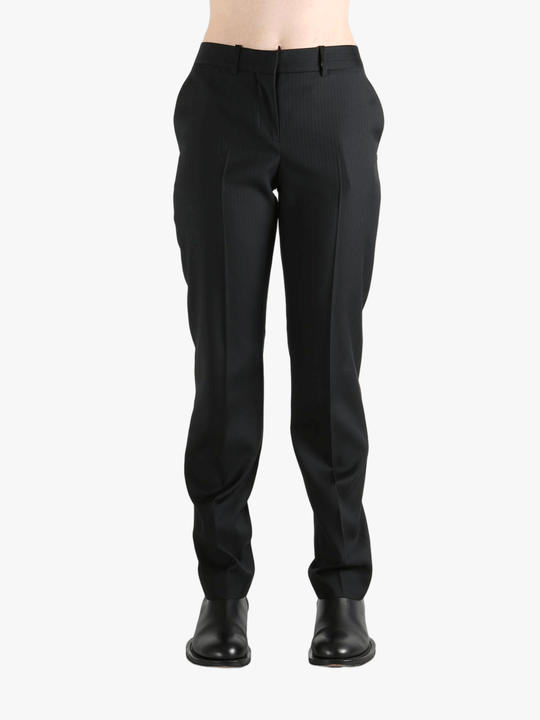 Grey pant worn by a person, showing the pant's fit