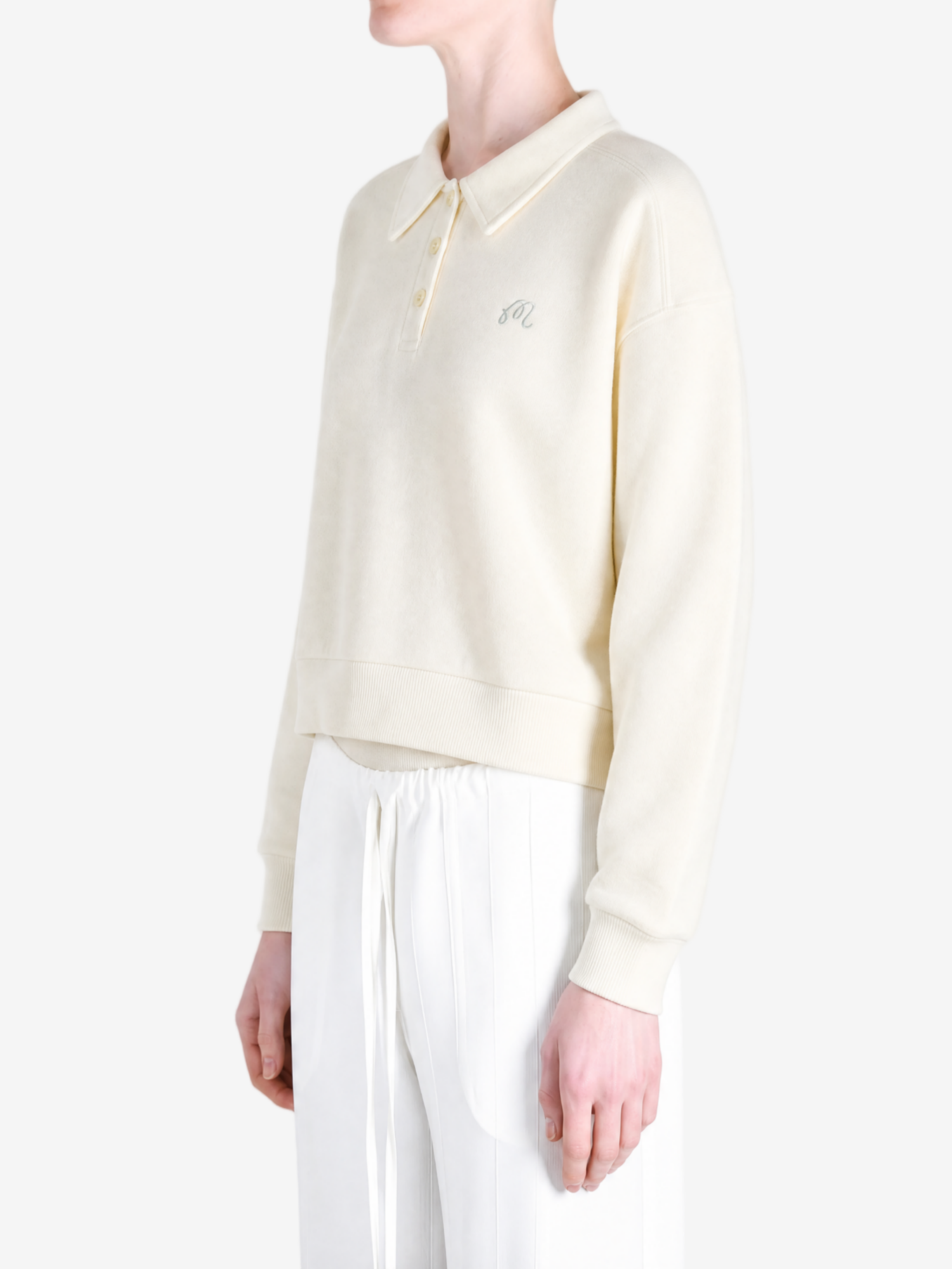 Tan hoodie worn by a person, showing the hoodie fit