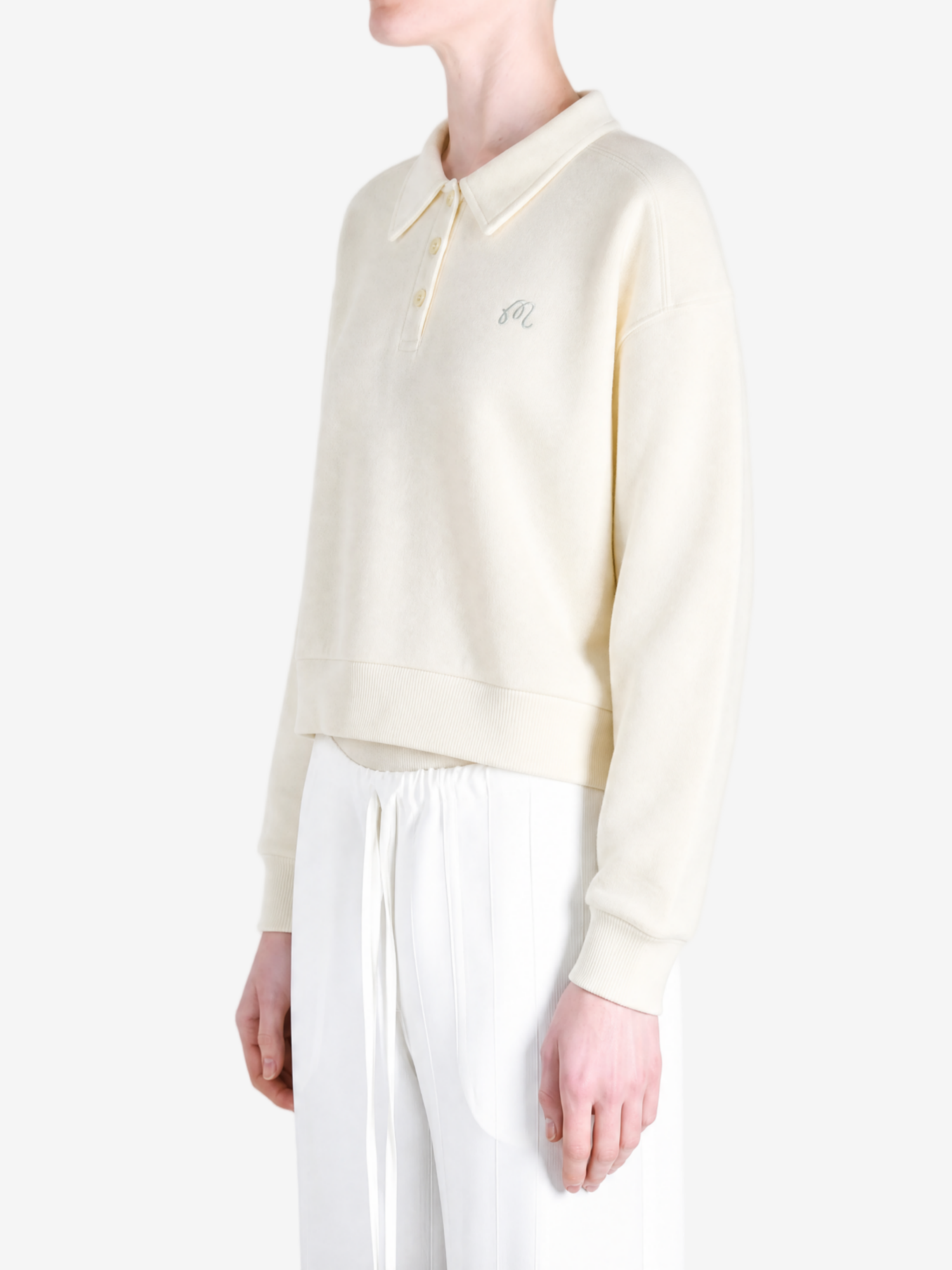 Tan hoodie worn by a person, showing the hoodie fit