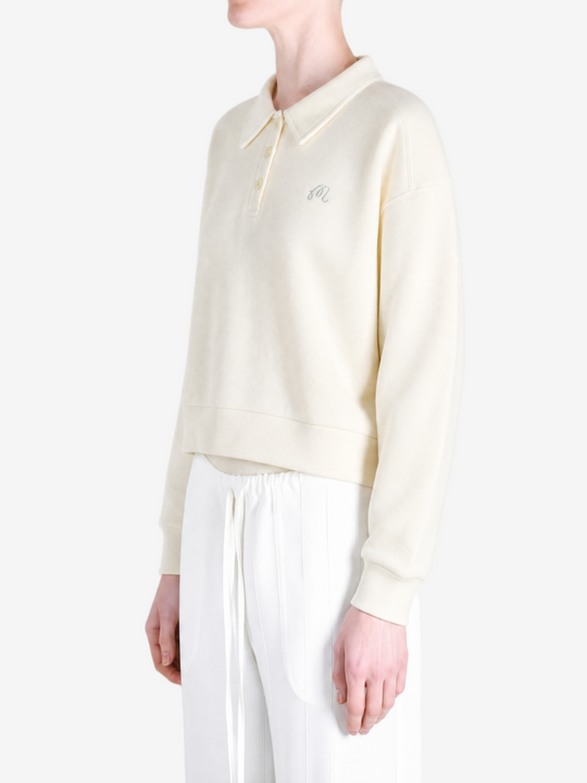 Tan hoodie worn by a person, showing the hoodie fit