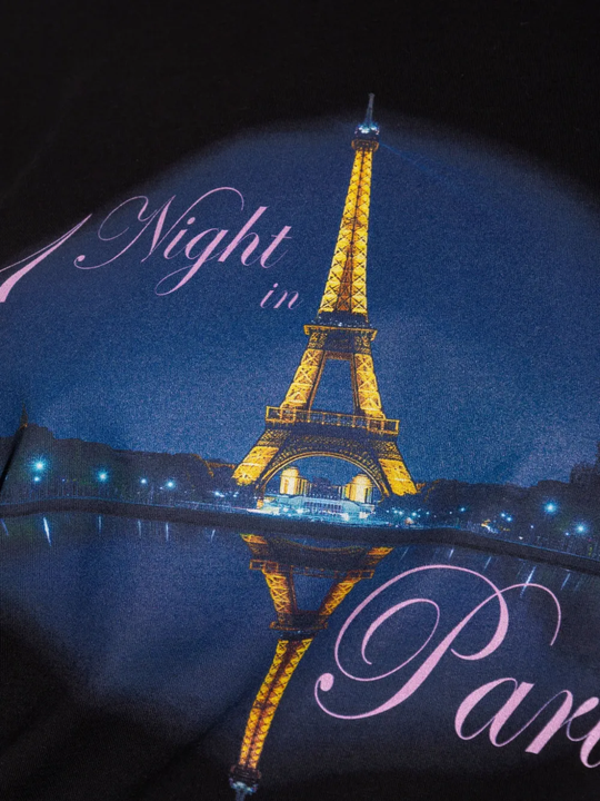 Close up of the black t-shirt, showing texture of the cotton fabric