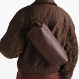 Brown bag worn by a person, showing the bag fit