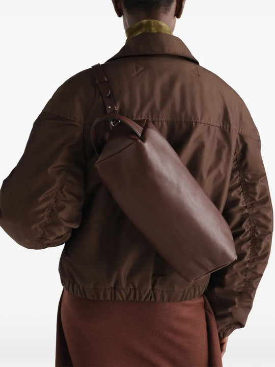 Brown bag worn by a person, showing the bag fit