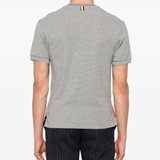 Grey t-shirt worn by a person, showing the t-shirt fit