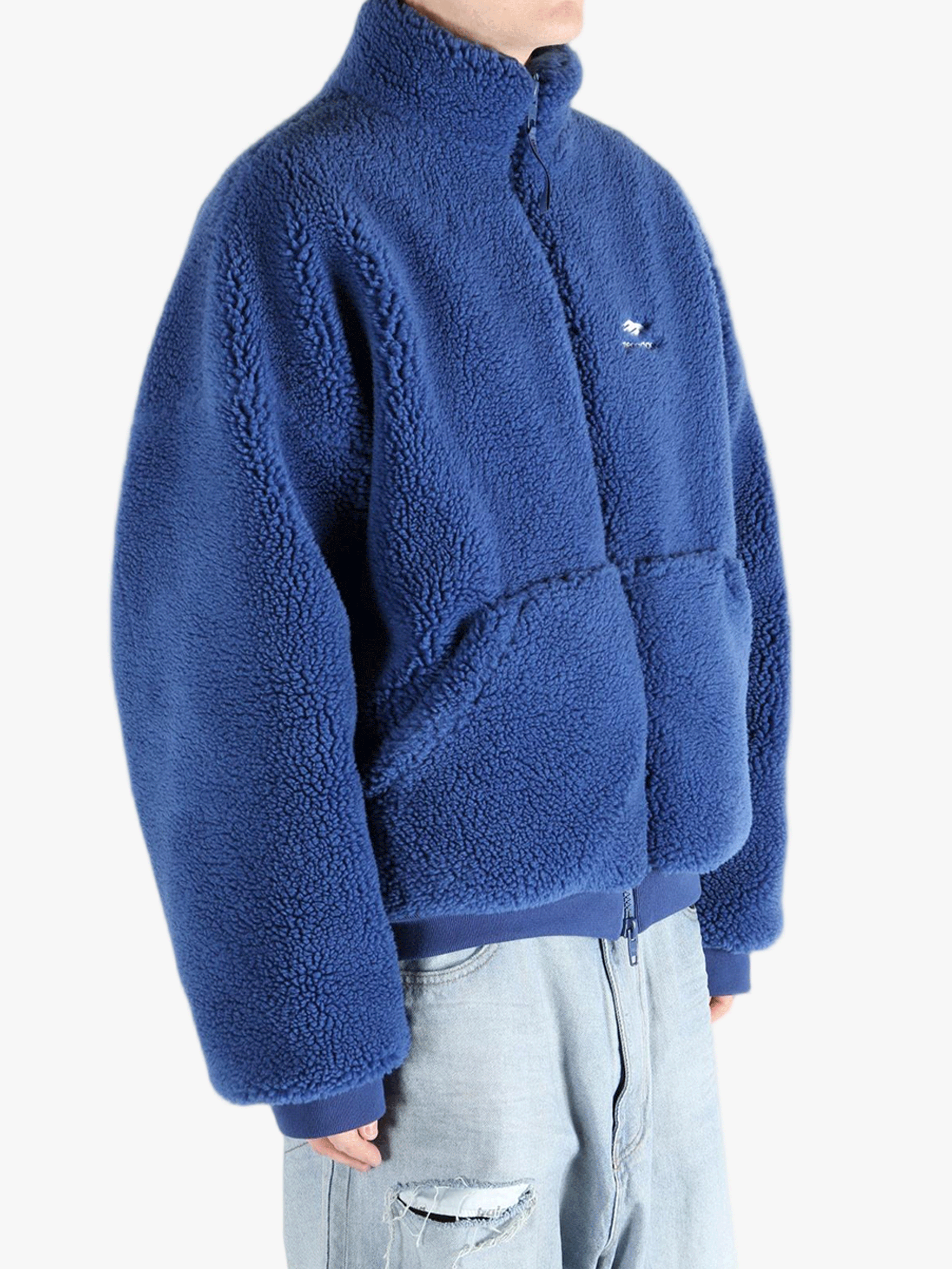 Blue jackets worn by a person, showing the jackets fit