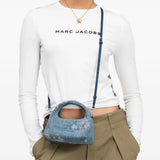 Blue bag worn by a person, showing the bag fit