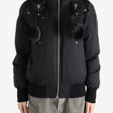 Black coat worn by a person, showing the coat fit