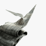 Close up of grey small accessories, showing texture of the silk fabric