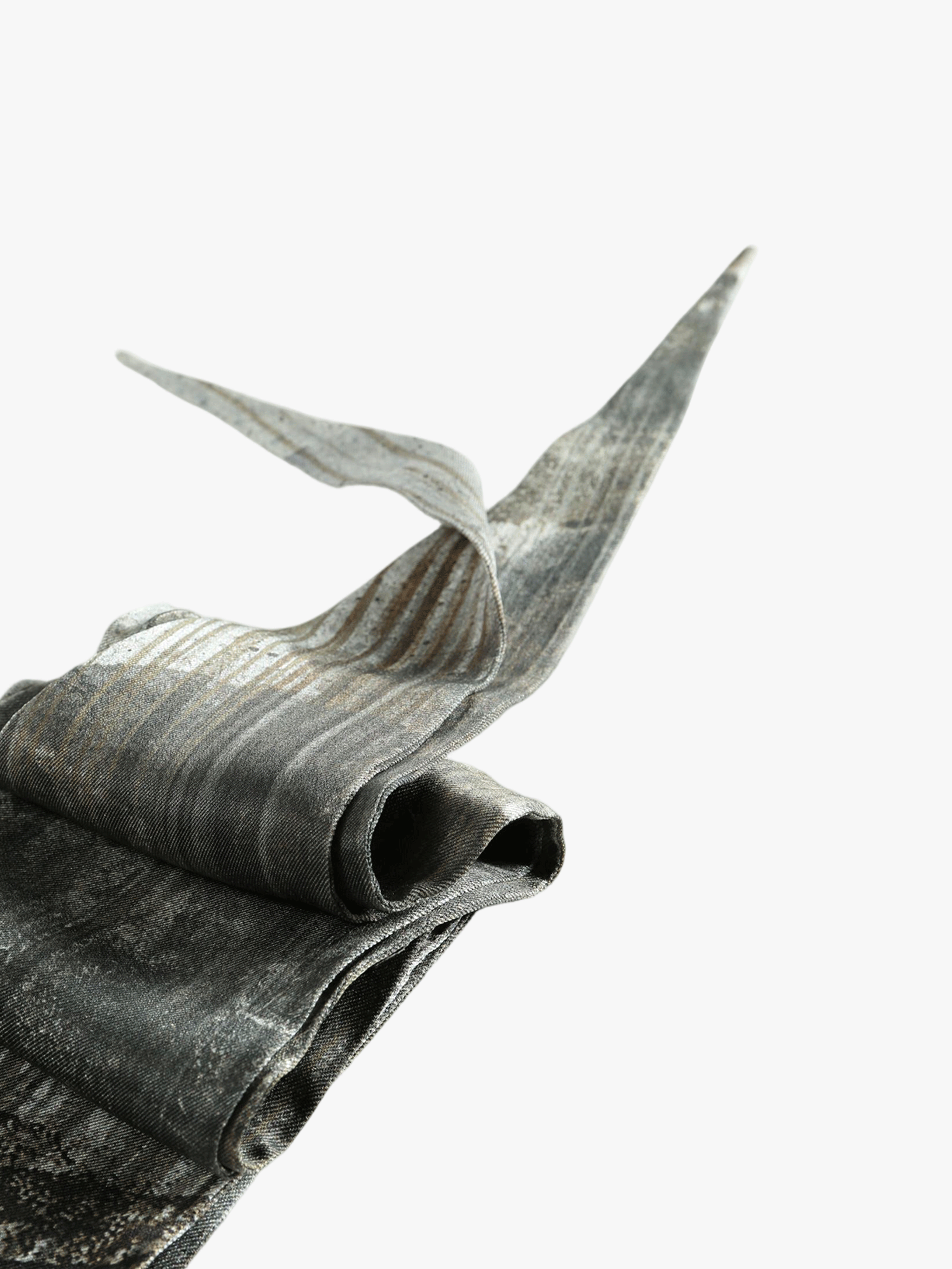 Close up of grey small accessories, showing texture of the silk fabric