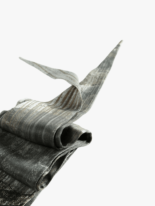 Close up of grey small accessories, showing texture of the silk fabric